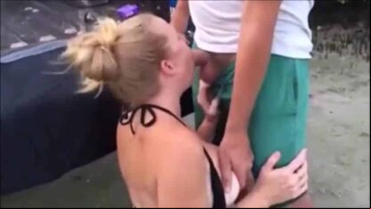 blowing a stranger at the beach